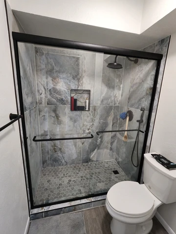 Tub-to-shower conversion in Garland, TX with marble-look tile