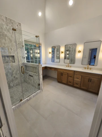 Modern tiled shower in a Plano, TX bathroom remodel