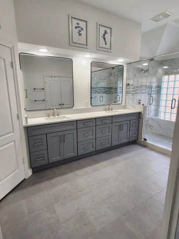 Rowlett, TX bathroom remodel with a double vanity and large mirrors