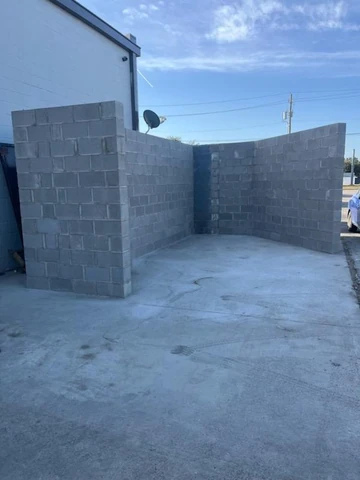 Completed CMU block wall on a Richardson, TX commercial site