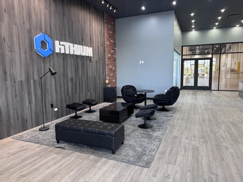 Finished commercial reception and lounge in Mesquite, TX with brick and wood-panel walls