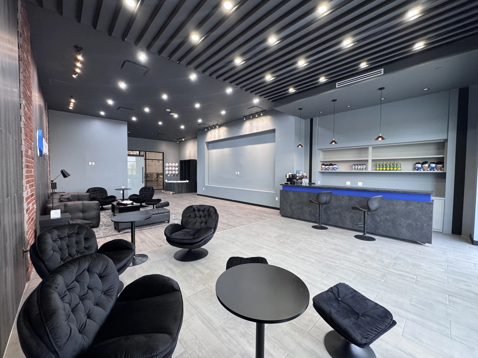 Commercial showroom finish-out in Mesquite, TX with a service counter and lounge seating