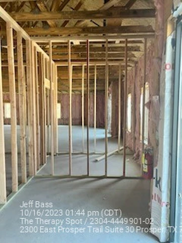 Framed corridor taking shape in a Prosper, TX commercial interior