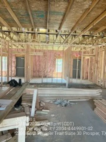 Lumber staged on site during a Prosper, TX commercial framing job