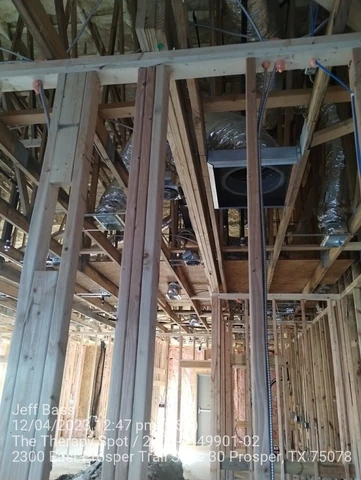 Structural posts and headers set during commercial framing in Prosper, TX