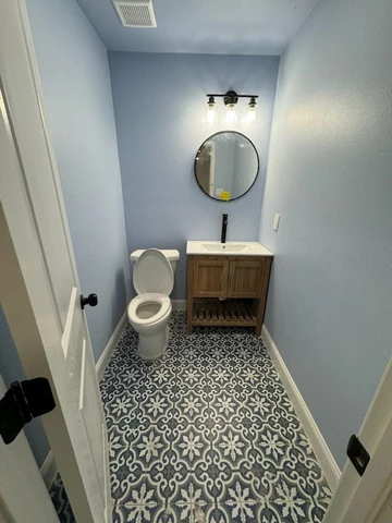 Guest bathroom addition in Dallas, TX with patterned floor tile