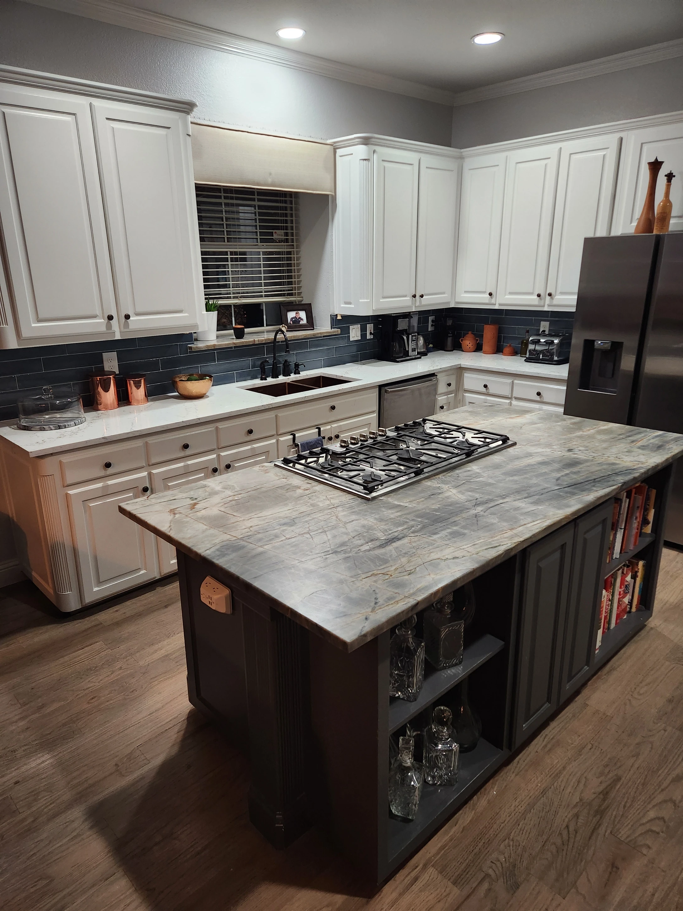 Kitchen remodel in Garland, TX featuring a quartzite island and gas cooktop