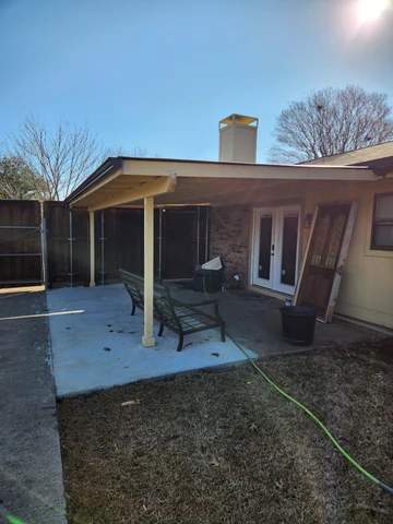 Bare concrete patio in Carrollton, TX before an outdoor living build