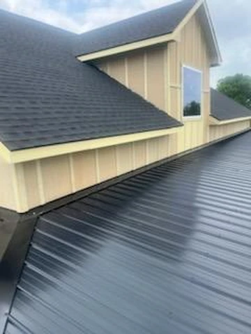 Standing seam metal roof and architectural shingle roof on a home in Richardson, TX